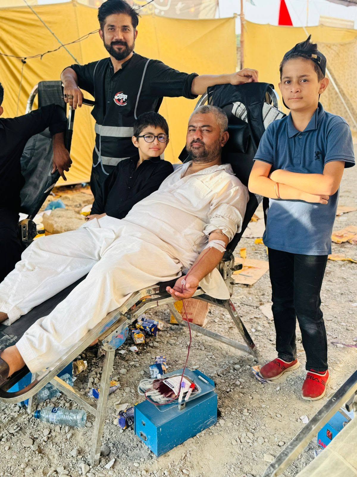 A donor and his family at a BMT blood camp